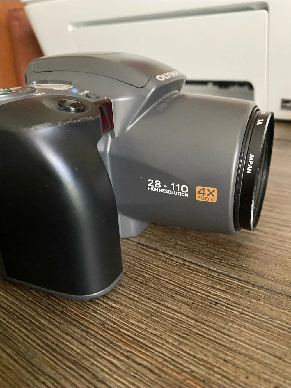 Olympus Digital Camera IS10 with Built-In Flash and Strap